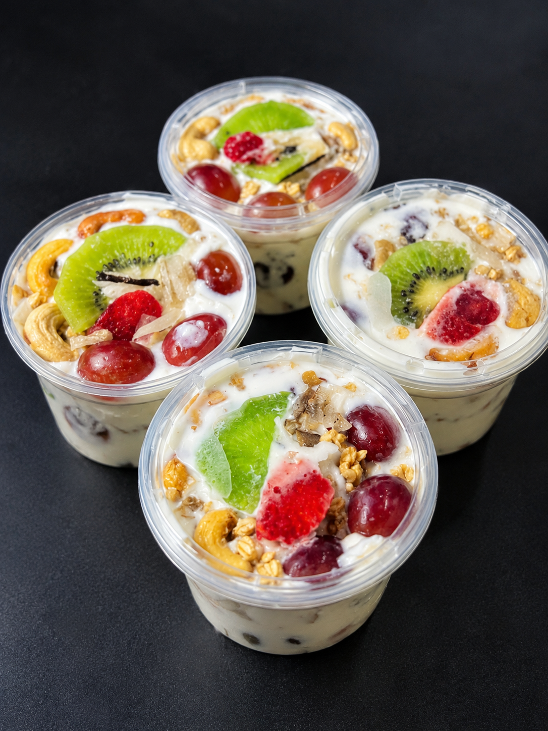 Four TRUE FRUIT Parfait MINI bowls with kiwi, strawberry, grapes and granola
